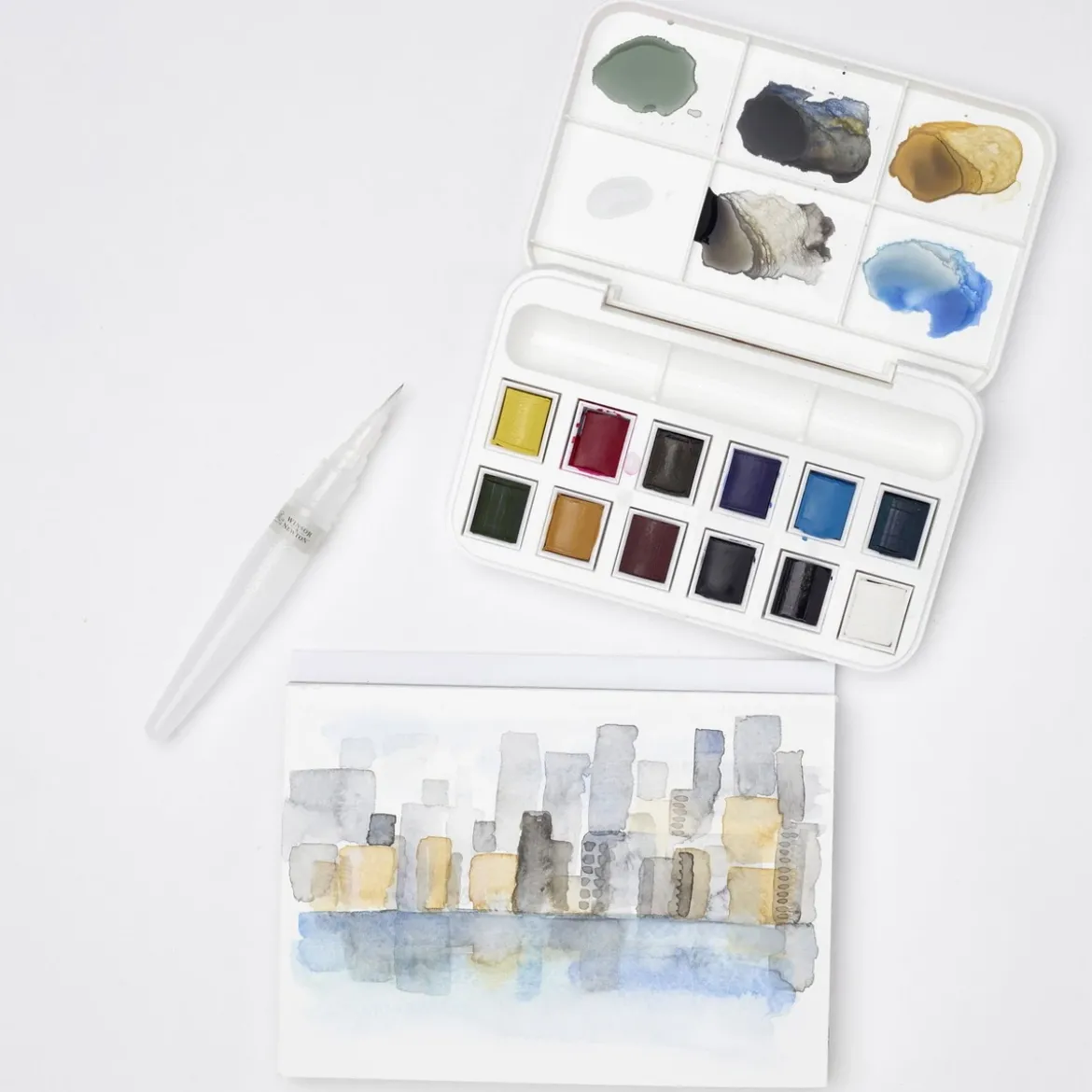Winsor & Newton Cotman Brush Pocket Set, 12 halvkoppar + vattenpensel